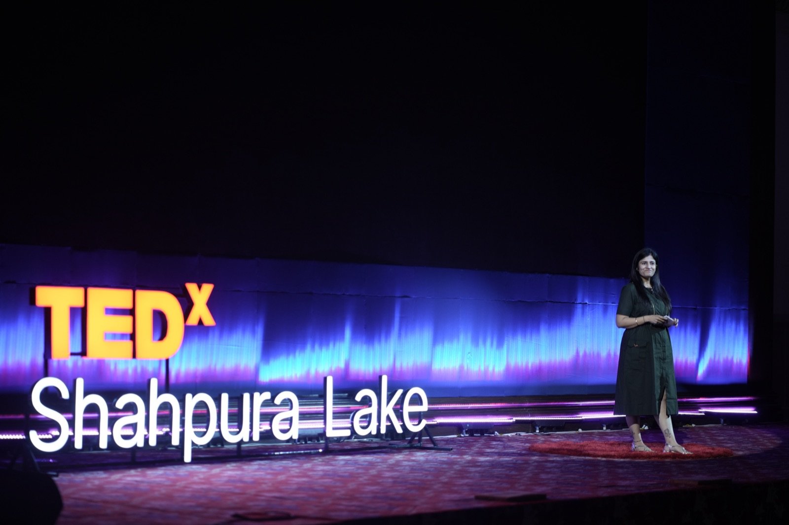 Speaker on the TEDxShahpura Lake stage