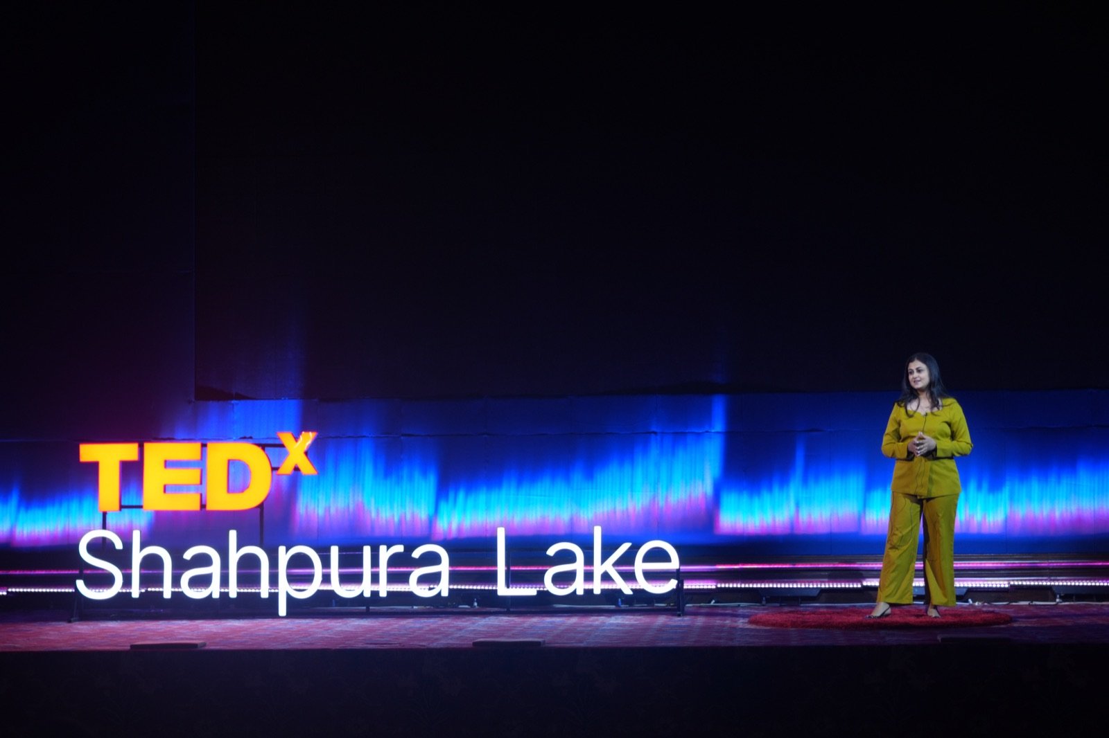 Speaker delivering a talk at TEDxShahpura Lake