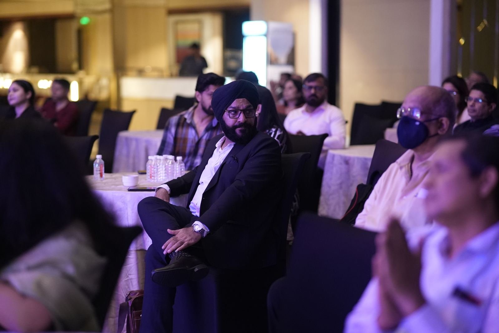 Attendees applauding a speaker