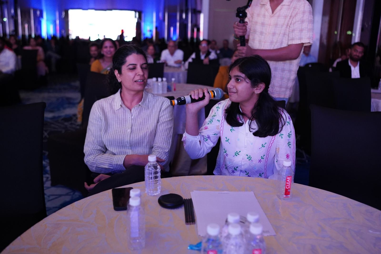 Attendees taking the mic during an audience interaction