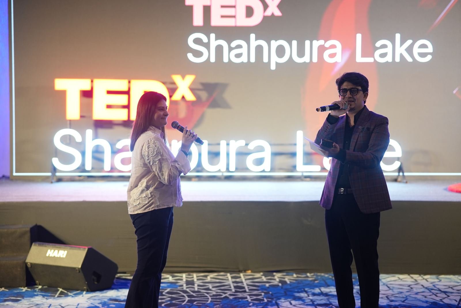 The hosts in conversation on stage